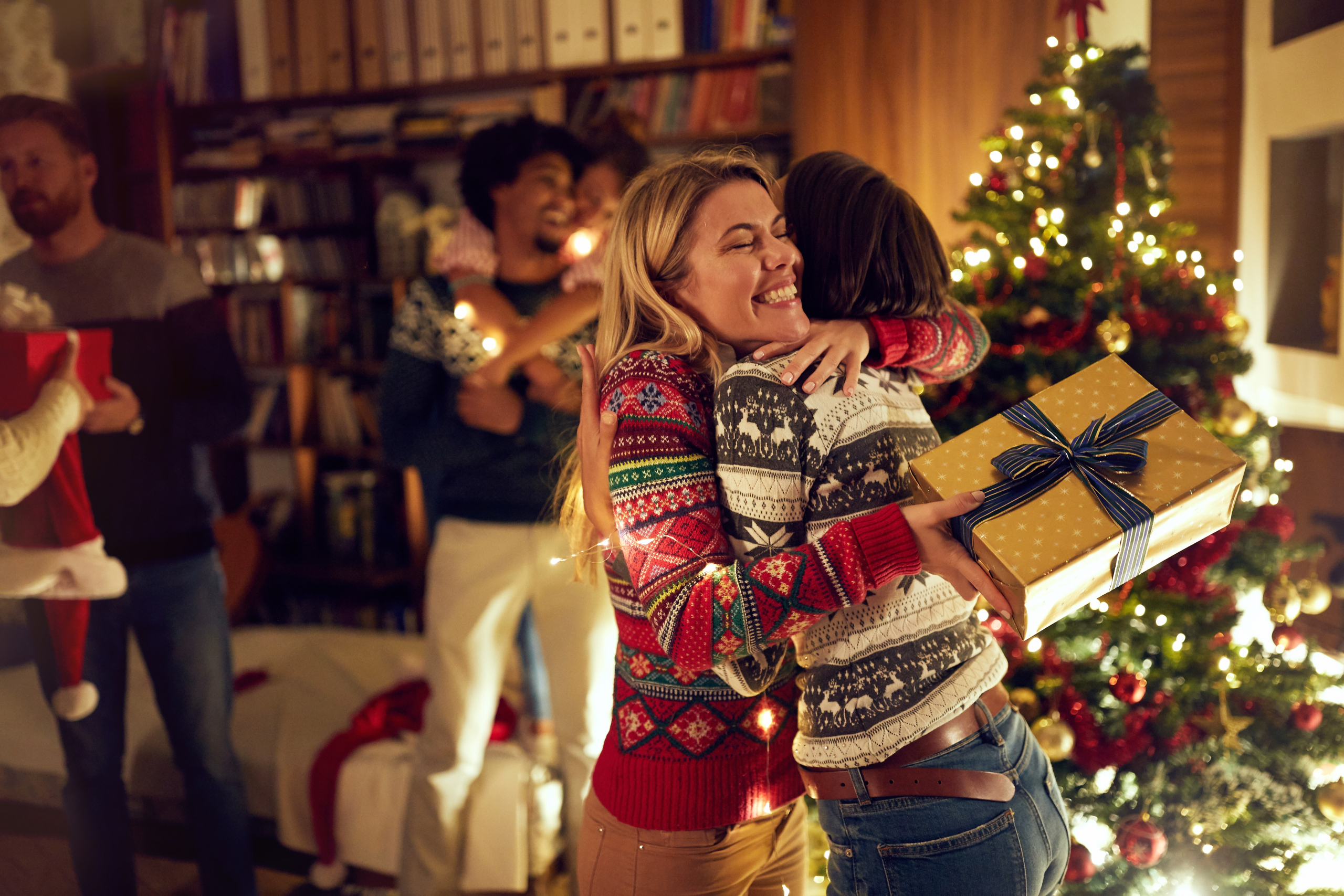 happy girlfriends celebrating Christmas together
